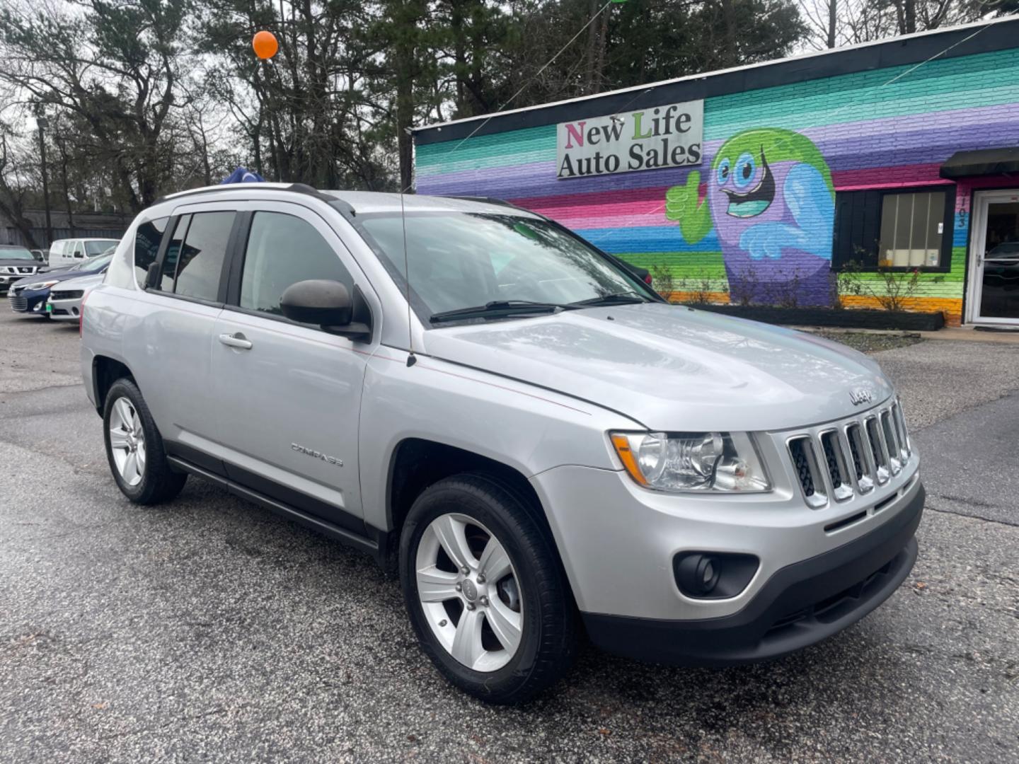 2012 SILVER JEEP COMPASS SPORT (1C4NJCBA8CD) with an 2.0L engine, Continuously Variable transmission, located at 5103 Dorchester Rd., Charleston, SC, 29418-5607, (843) 767-1122, 36.245171, -115.228050 - Spacious Interior with CD/AUX/AM/FM, Hands-free Phone, Power Windows, Power Locks, Power Windows, Power Mirrors, Keyless Entry, Alloy Wheels. Local Trade-in!! 108k miles Located at New Life Auto Sales! 2023 WINNER for Post & Courier's Charleston's Choice Pre-owned Car Dealer AND 2018-2024 Top 5 Fin - Photo#0